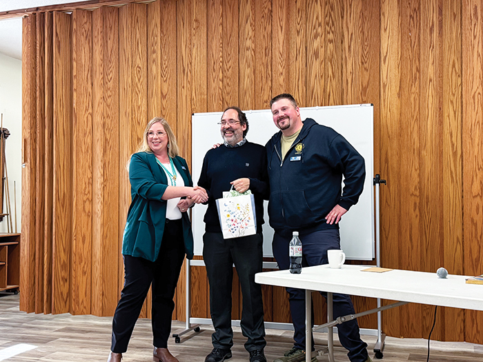 From left to right, Jennifer Sedor, Mayor of Carlyle, presented a gift to Dr. Roger Petry for coming out to Carlyle, along with Tim Sedor, President of the Carlyle District Lions Club.
